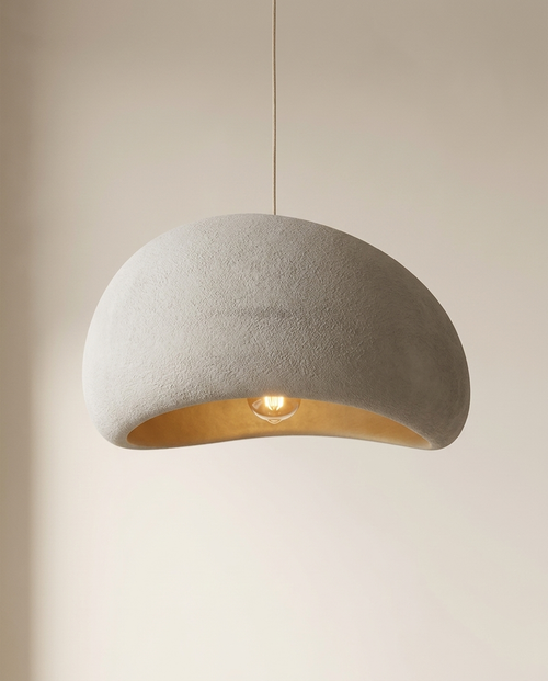 Grey wabi-sabi plaster dome pendant light with warm glow, Pale Meridian